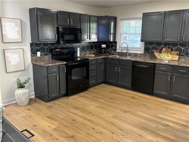 Beautifully updated with an open floor plan, this charming on Royal Meadows Golf Course in Missouri - for sale on GolfHomes.com, golf home, golf lot