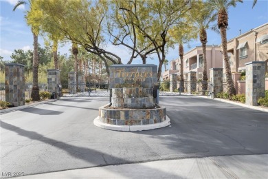 Discover luxury living in this stunning two-story corner unit on TPC at Summerlin in Nevada - for sale on GolfHomes.com, golf home, golf lot