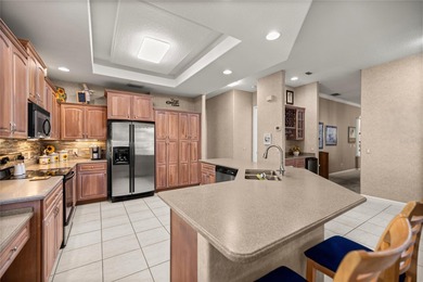 Welcome to this Entertainer's Dream Property overlooking the on Ocala Palms Golf and Country Club in Florida - for sale on GolfHomes.com, golf home, golf lot