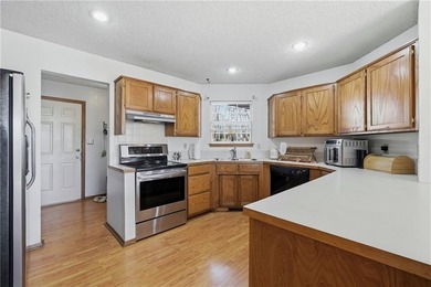 Enjoy a lake view setting paired with a flexible floor plan full on Bella Vista Country Club - Scottsdale in Arkansas - for sale on GolfHomes.com, golf home, golf lot