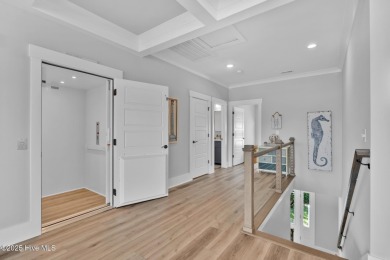 Experience luxury coastal living at its finest on Oak Island's on Founders Club At St. James Plantation in North Carolina - for sale on GolfHomes.com, golf home, golf lot