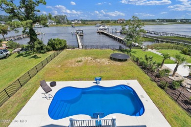 Experience luxury coastal living at its finest on Oak Island's on Founders Club At St. James Plantation in North Carolina - for sale on GolfHomes.com, golf home, golf lot