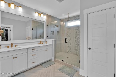 Experience luxury coastal living at its finest on Oak Island's on Founders Club At St. James Plantation in North Carolina - for sale on GolfHomes.com, golf home, golf lot