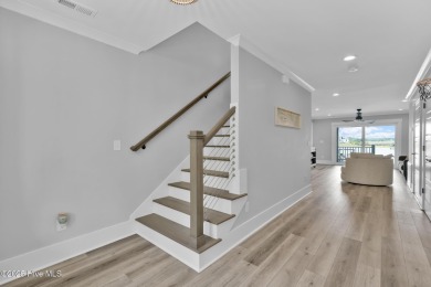 Experience luxury coastal living at its finest on Oak Island's on Founders Club At St. James Plantation in North Carolina - for sale on GolfHomes.com, golf home, golf lot