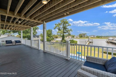 Experience luxury coastal living at its finest on Oak Island's on Founders Club At St. James Plantation in North Carolina - for sale on GolfHomes.com, golf home, golf lot