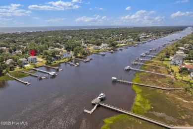 Experience luxury coastal living at its finest on Oak Island's on Founders Club At St. James Plantation in North Carolina - for sale on GolfHomes.com, golf home, golf lot