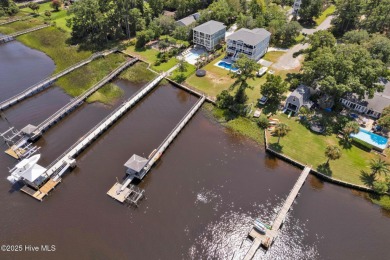 Experience luxury coastal living at its finest on Oak Island's on Founders Club At St. James Plantation in North Carolina - for sale on GolfHomes.com, golf home, golf lot
