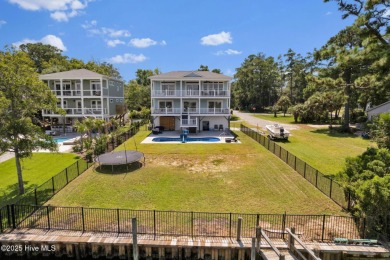 Experience luxury coastal living at its finest on Oak Island's on Founders Club At St. James Plantation in North Carolina - for sale on GolfHomes.com, golf home, golf lot