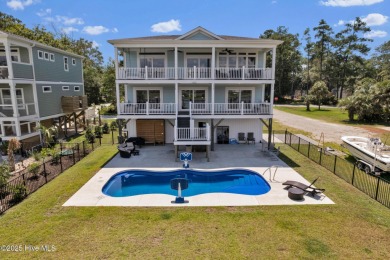 Experience luxury coastal living at its finest on Oak Island's on Founders Club At St. James Plantation in North Carolina - for sale on GolfHomes.com, golf home, golf lot