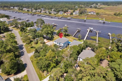 Experience luxury coastal living at its finest on Oak Island's on Founders Club At St. James Plantation in North Carolina - for sale on GolfHomes.com, golf home, golf lot