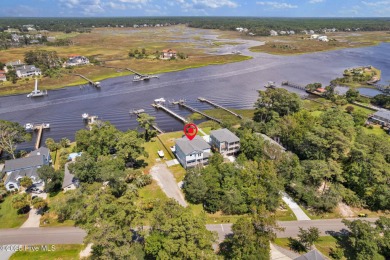 Experience luxury coastal living at its finest on Oak Island's on Founders Club At St. James Plantation in North Carolina - for sale on GolfHomes.com, golf home, golf lot