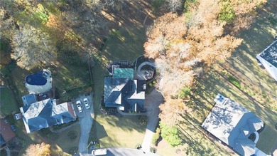 Situated on a serene cul-de-sac street within Woodmont Golf and on Woodmont Golf and Country Club in Georgia - for sale on GolfHomes.com, golf home, golf lot