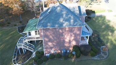 Situated on a serene cul-de-sac street within Woodmont Golf and on Woodmont Golf and Country Club in Georgia - for sale on GolfHomes.com, golf home, golf lot