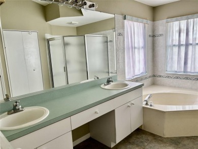 Welcome to a lovely home situated on a large corner lot in the on Caloosa Greens Executive Golf Course in Florida - for sale on GolfHomes.com, golf home, golf lot
