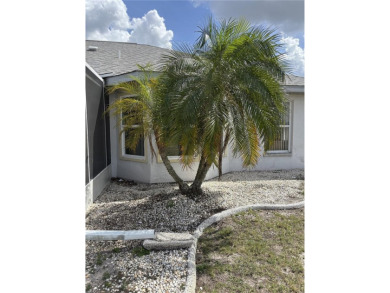 Welcome to a lovely home situated on a large corner lot in the on Caloosa Greens Executive Golf Course in Florida - for sale on GolfHomes.com, golf home, golf lot