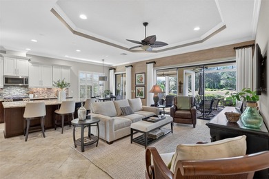 Experience elevated Florida living in this elegantly upgraded on Esplanade Golf and Country at Lakewood Ranch in Florida - for sale on GolfHomes.com, golf home, golf lot
