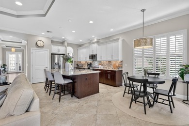 Experience elevated Florida living in this elegantly upgraded on Esplanade Golf and Country at Lakewood Ranch in Florida - for sale on GolfHomes.com, golf home, golf lot
