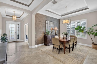 Experience elevated Florida living in this elegantly upgraded on Esplanade Golf and Country at Lakewood Ranch in Florida - for sale on GolfHomes.com, golf home, golf lot