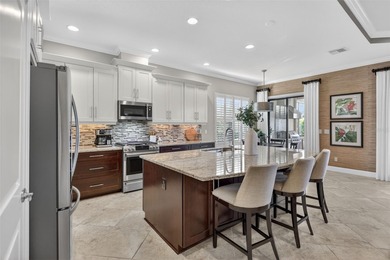 Experience elevated Florida living in this elegantly upgraded on Esplanade Golf and Country at Lakewood Ranch in Florida - for sale on GolfHomes.com, golf home, golf lot