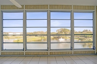 Discover this stunning top-floor 2-bed, 2-bath condo in the on Wynmoor Golf Course in Florida - for sale on GolfHomes.com, golf home, golf lot