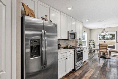 Welcome to a life that feels like vacation every day. Nestled in on Arlington Ridge Golf Club in Florida - for sale on GolfHomes.com, golf home, golf lot