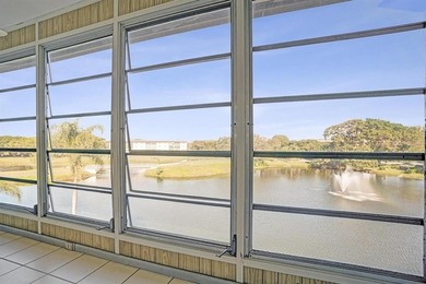 Discover this stunning top-floor 2-bed, 2-bath condo in the on Wynmoor Golf Course in Florida - for sale on GolfHomes.com, golf home, golf lot