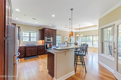 At 3220 Moss Hammock Wynd, craftsmanship and prestige unite in on Members Club At St. James Plantation in North Carolina - for sale on GolfHomes.com, golf home, golf lot