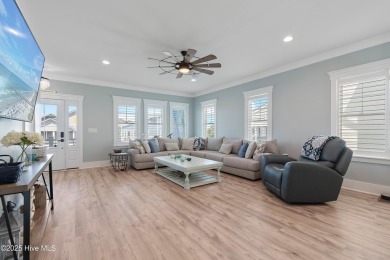 Charming Sunset Beach House custom built in 2023 is simply on Oyster Bay Golf Links in North Carolina - for sale on GolfHomes.com, golf home, golf lot