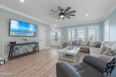 Charming Sunset Beach House custom built in 2023 is simply on Oyster Bay Golf Links in North Carolina - for sale on GolfHomes.com, golf home, golf lot