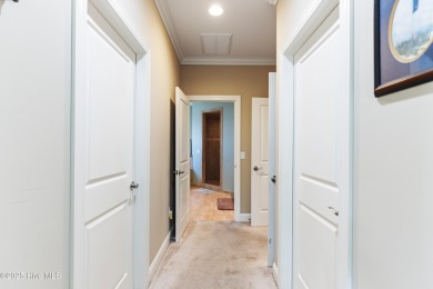 At 3220 Moss Hammock Wynd, craftsmanship and prestige unite in on Members Club At St. James Plantation in North Carolina - for sale on GolfHomes.com, golf home, golf lot