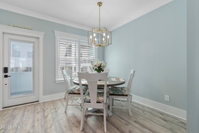 Charming Sunset Beach House custom built in 2023 is simply on Oyster Bay Golf Links in North Carolina - for sale on GolfHomes.com, golf home, golf lot