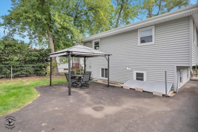 Tucked away on a peaceful, tree-lined street in coveted North on Downers Grove Golf Club in Illinois - for sale on GolfHomes.com, golf home, golf lot