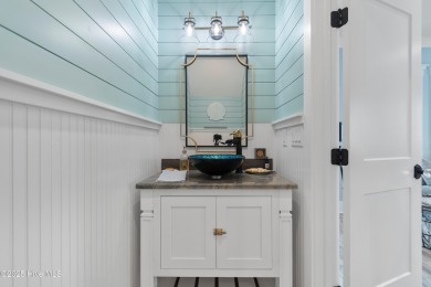 Charming Sunset Beach House custom built in 2023 is simply on Oyster Bay Golf Links in North Carolina - for sale on GolfHomes.com, golf home, golf lot