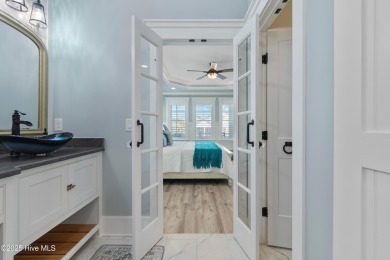 Charming Sunset Beach House custom built in 2023 is simply on Oyster Bay Golf Links in North Carolina - for sale on GolfHomes.com, golf home, golf lot
