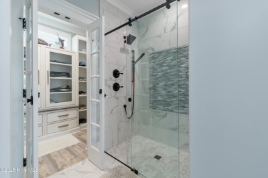 Charming Sunset Beach House custom built in 2023 is simply on Oyster Bay Golf Links in North Carolina - for sale on GolfHomes.com, golf home, golf lot