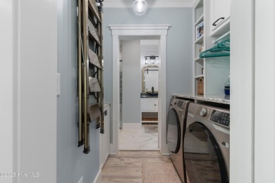 Charming Sunset Beach House custom built in 2023 is simply on Oyster Bay Golf Links in North Carolina - for sale on GolfHomes.com, golf home, golf lot