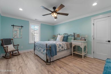 Charming Sunset Beach House custom built in 2023 is simply on Oyster Bay Golf Links in North Carolina - for sale on GolfHomes.com, golf home, golf lot