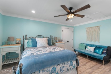 Charming Sunset Beach House custom built in 2023 is simply on Oyster Bay Golf Links in North Carolina - for sale on GolfHomes.com, golf home, golf lot