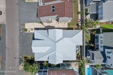 Charming Sunset Beach House custom built in 2023 is simply on Oyster Bay Golf Links in North Carolina - for sale on GolfHomes.com, golf home, golf lot