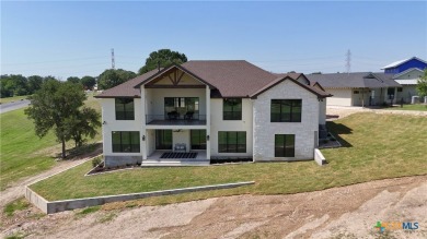 This stunning new build with exceptional views is located on the on The Bandit Golf Club in Texas - for sale on GolfHomes.com, golf home, golf lot
