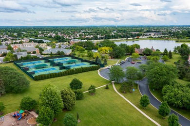 Welcome to this exquisite home nestled down a tree-lined street on White Eagle Golf Club in Illinois - for sale on GolfHomes.com, golf home, golf lot