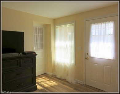 Completely renovated in 2020 this year round home sits on the on Lake Lackawanna Golf Course in New Jersey - for sale on GolfHomes.com, golf home, golf lot