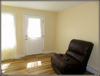 Completely renovated in 2020 this year round home sits on the on Lake Lackawanna Golf Course in New Jersey - for sale on GolfHomes.com, golf home, golf lot