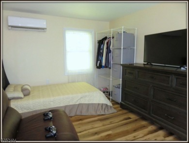 Completely renovated in 2020 this year round home sits on the on Lake Lackawanna Golf Course in New Jersey - for sale on GolfHomes.com, golf home, golf lot