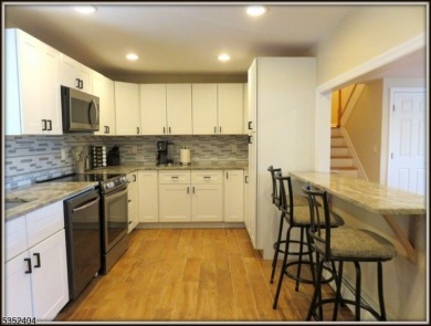 Completely renovated in 2020 this year round home sits on the on Lake Lackawanna Golf Course in New Jersey - for sale on GolfHomes.com, golf home, golf lot