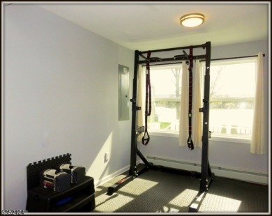 Completely renovated in 2020 this year round home sits on the on Lake Lackawanna Golf Course in New Jersey - for sale on GolfHomes.com, golf home, golf lot