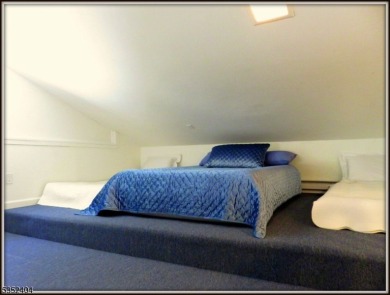 Completely renovated in 2020 this year round home sits on the on Lake Lackawanna Golf Course in New Jersey - for sale on GolfHomes.com, golf home, golf lot
