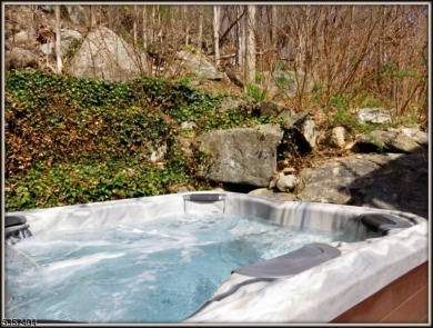 Completely renovated in 2020 this year round home sits on the on Lake Lackawanna Golf Course in New Jersey - for sale on GolfHomes.com, golf home, golf lot