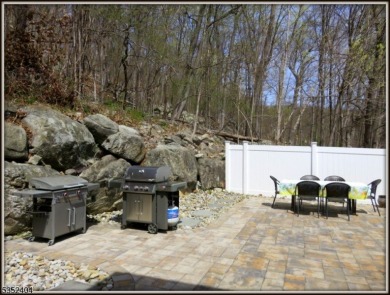 Completely renovated in 2020 this year round home sits on the on Lake Lackawanna Golf Course in New Jersey - for sale on GolfHomes.com, golf home, golf lot