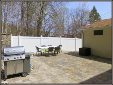 Completely renovated in 2020 this year round home sits on the on Lake Lackawanna Golf Course in New Jersey - for sale on GolfHomes.com, golf home, golf lot
